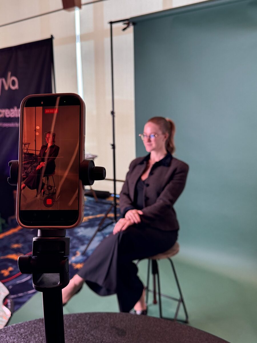 Shelby filming content on a set